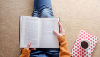 reading-concept-soft-focus-young-woman-relaxing-by-book-cozy-house