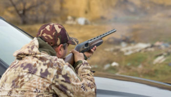 hunter-man-camouflage-with-gun-during-hunt-search-wild-birds-game (2)