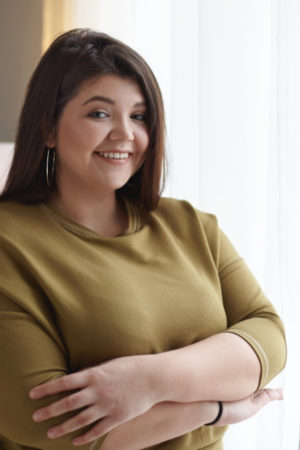 people-body-positivity-lifestyle-concept-indoor-image-adorable-overweight-chubby-young-lady-relaxing-home-standing-window-crossing-arms-her-chest-smiling-broadly