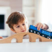 kid-playing-with-toy-train